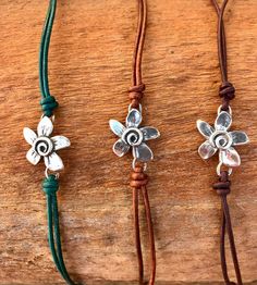 Introducing our .925 sterling silver flower on leather cord bracelet with hook and eye clasp - a delicate piece designed to enhance your everyday style. Choose your preferred color of leather cord to customize this dainty accessory to your liking.  The bracelet is great for stacking with other bracelets. The simplicity of the design makes it a versatile addition to any outfit, whether casual or dressy. This bracelet is more than just a fashion statement; it's a symbol of positivity and flower po Woman Bracelets, Simple Leather Bracelet, Autumn Jewelry, Stone Bead Jewelry, Leather Cord Bracelets, Cord Bracelet, Leather Bracelets, Fall Jewelry, Sterling Silver Flowers