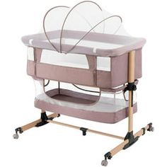 a baby crib with wheels and a clear cover on the top, in front of a white background