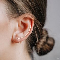 Add a unique finish to your look with these Dainty Long Ear Climbers. Crafted from 35 mm of sterling silver, gold, or rose gold, these earrings will be sure to catch attention no matter the occasion. Feel confident knowing that you can trust in the high quality of these earrings. Before ordering, please check what else we make * www.etsy.com/shop/bysdmjewels * * handmade hammered ear climbers * Buy as a single or pair * Available in: Solid 925 Sterling Silver, Gold filled 12k and Rose gold filled 12k * Available lenght: 10mm, 15mm, 20mm, 25mm, 30mm, 35mm, 40mm, 45mm and 50mm * Wire Thickness - 1mm 18gauge H O W * T O * P U T * C L I M B E R * O N Climber earring require one standard ear lobe piercing. To put it on, simply place it through your pierced hole like ordinary french wire earring Ear Climber Earrings Silver, Ear Sweeps, Ear Climber Earrings, Ear Lobe Piercings, Ear Crawler, French Wire Earrings, Ear Crawlers, Ear Climbers Earrings, Ear Climber