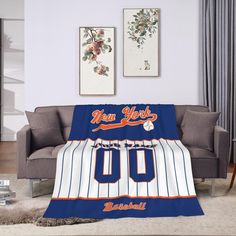 the new york mets baseball jersey is on display in this living room