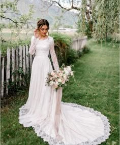 a woman in a wedding dress holding a bouquet