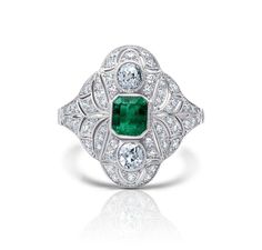 One of a kind handmade Art Deco platinum ring designed using 100% natural, genuine, and conflict-free Colombian emerald gemstone and diamonds. Not treated or enhanced in any way. Oiling only for emerald. This ring is embedded with a center Square Cut Cut Emerald and accented with two brilliant rose cut diamonds, and brilliant round cut diamonds. Unique and Stunning! Ring is independently certified and appraised by GIA Certified gemologists. Metal: Platinum 850 Dimensions: Weight: 5.5 grams Width: 18.3 MM Face of Ring Certificate: GGA Certified Emerald Details: Main Stone: Emerald Carat Weight: 0.41 CT Shape: Emerald Color/Clarity: Medium Green/VS, Type III, Eye Clean Cut: Excellent Certificate: GGA Nature: 100% Natural Emerald, Not Treated, Not Enhanced. Oiling only. Other Diamond Details Art Deco Emerald Ring, Columbian Emeralds, Jewellery Ring, Blood Diamond, Platinum Diamond Rings, Ring Art Deco, Ring Antique, Antique Inspiration, Antique Roses