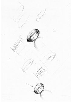 a pencil drawing of rings on a white paper