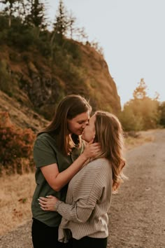 two women kissing each other on the road