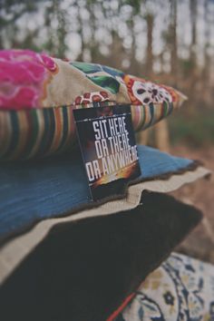 a book sitting on top of a pile of pillows