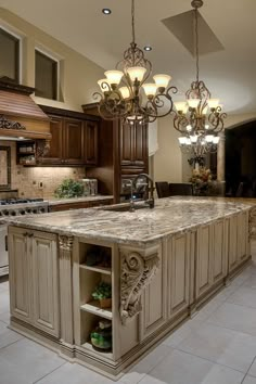 a large kitchen with an island and chandelier