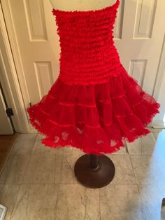 "This crinoline has a dropped waist full of tiny ruffles, and then 2 VERY full layers of nylon crinoline---not the scratchy stuff! If you were crafty, you could put straps on it and make it a dress! Made in the 90s, but in the style of the 50s. Waist 28\" stretches to 46\" Length 14\" of dropped waist; 31\" in total Sweep of hem 80\"" Womens Skirts, The 50s, Drop Waist, The 90s, Ruffles, Mermaid, Womens Skirt, Clothes For Women, Red