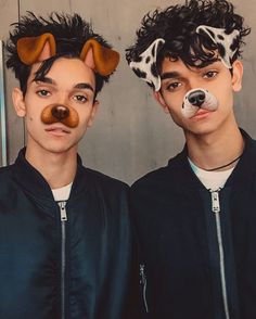 two young men with fake dogs on their faces are posing for the camera while wearing animal ears