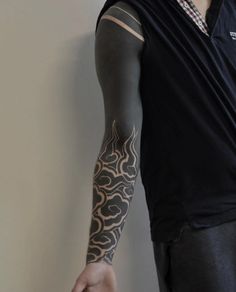 a man with a tattoo on his arm