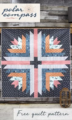 a quilt is hanging on the side of a wooden wall with an american flag design