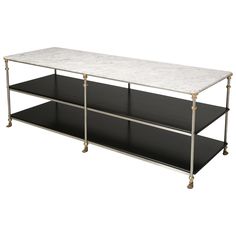 a black and white marble top coffee table with brass trimmings on the legs