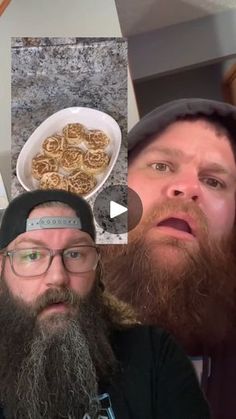 two men with long beards are looking at the camera and one is holding a bowl of food