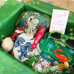 a birthday gift box filled with toys and personal items for a child's birthday