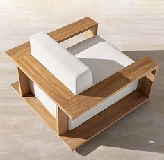 a wooden box with two white cushions on it