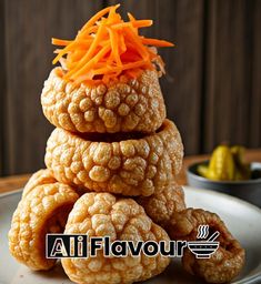 a stack of food sitting on top of a white plate