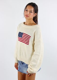 We are loving this American Flag Sweater. Featuring a bold flag design, this cozy sweater is perfect for the fall weather. The soft knit fabric and relaxed fit make it great for layering or wearing on its own. Pair it with denim shorts or jeans for a timeless, casual look. The Details Stitched American Flag on Front Ribbed Hem and Cuffs Rounded Neckline 100% Acrylic [#other] Wash With Like Colors Machine Wash Cold Do Not Bleach [/other] Hamptons Outfit Summer, Comfy Outfits Lazy, School Outfits Comfy, Going Out Skirts, Flag Sweater, American Flag Sweater, Pumpkin Patch Outfit, Mini Skirt Dress, Sweat Joggers