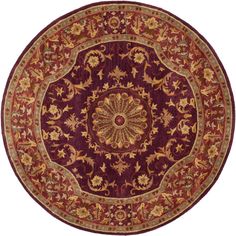 a round rug with an ornate design on the center and sides in red, gold and green colors