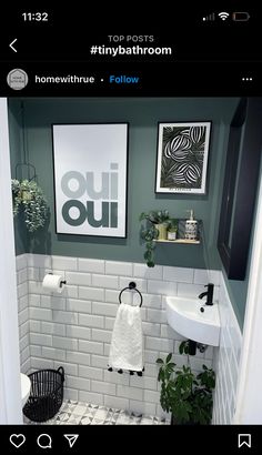 a bathroom with green walls and white tile flooring is seen in this instagramted photo