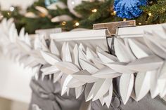 an origami style purse hanging from a christmas tree