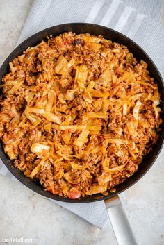 a skillet filled with ground beef and cabbage