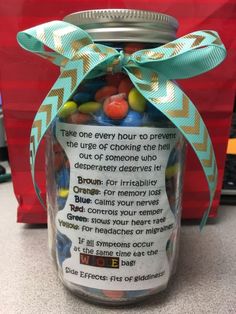 a jar filled with candy sitting on top of a counter