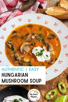 a bowl of authentic hungarian mushroom soup with sour cream and green peppers on the side