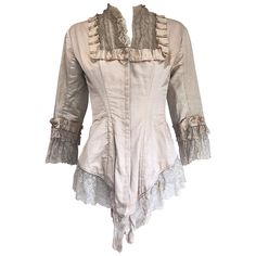 Incredible authentic Victorian Era (approximately 1880s) ivory silk lace corset bustier blouse! Features a fitted boned bodice with hook-and-eye closures up the front. Puckered silk details around the neck and sleeve cuffs. Layers of matching French lace at each sleeve cuff and at the triangular hem. This rare gem is in good quality for its age (It is nearly 150 years old). Though wearable, there are stains throughout, and the silk is fragile in certain places. Perfect inspiration for a designer or a collector. Approximately Size Small Measurements: 32 inch bust 24 inch waist Summer Steampunk, Summer Corset, Bustier Blouse, Couture Blouse, Victorian Corset, Picture Board, Romantic Fashion, Bustle Dress, Boned Bodice