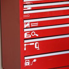 a red toolbox with white writing on it