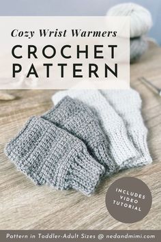 the cozy wrist warmers crochet pattern is shown on a table with knitting needles