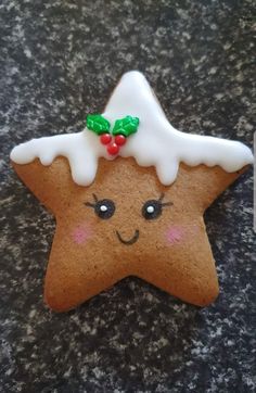 a star shaped cookie with icing on it