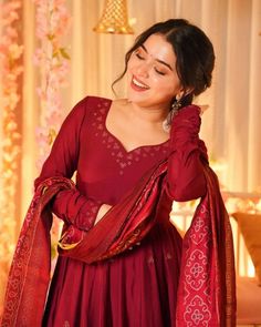 Embrace timeless elegance with this rich maroon Anarkali, adorned with subtle embroidery for a refined festive look. The intricate details on the neckline and sleeves add a touch of sophistication, while the beautifully coordinated dupatta enhances the grace of this traditional ensemble. Perfect for Diwali gatherings, wedding festivities, or formal celebrations, this outfit brings out an understated charm with a modern appeal. Maroon Anarkali, Chaniya Choli Designs, Embroidery Indian, Gown With Dupatta, Wedding Festivities, Exquisite Gowns, Choli Designs