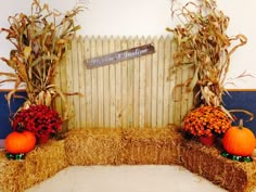 hay bales with pumpkins and gourds on them