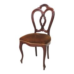 a wooden chair with a leather seat and back