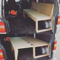 the back end of a van with two tables in it