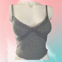 Wild Fable Junior Camisole Top. Heather Gray S Armpit To Armpit 13 Inches 12” From Top Of Chest To Bottom Hem M Armpit To Armpit 14 Inches. 12 Inches From Top Of Chest To Bottom L Pit On Pit 15 Inches 12 Inches From Top Of Chest To Bottom Hem Xl 17 Inches Armpit Armpit Call And 13 Inches From Top Of Chest To Bottom Hem Fitted Gray Sleeveless Camisole, Trendy Gray Cami Tank Top, Gray Fitted Cami Tank Top, Gray Spring Camisole Tank Top, Fitted Gray Summer Camisole, Gray Camisole Tank Top For Spring, Gray Seamless Cami Top, Gray Fitted Spaghetti Strap Tank Top, Fitted Gray Spaghetti Strap Tank Top