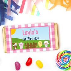 personalized candy bar with candies, lollipops and streamers in the background