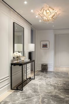 a room with marble floors and white walls