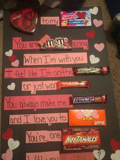 valentine's day candy bar sign with handwritten notes and hearts on the board