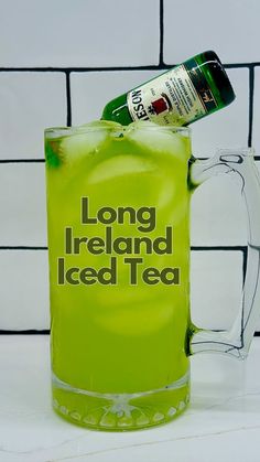 a green drink in a glass mug with the words long ireland iced tea on it