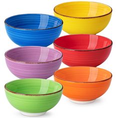 four different colored bowls are stacked together