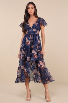 You'll be the loveliest guest when you arrive in the Lulus Cultivated Adoration Navy Floral Backless High-Low Midi Dress! Airy woven organza boasts a chic floral print as it shapes short sleeves and a princess-seamed bodice with short, fluttery sleeves and a plunging V-neckline. Turn around to reveal a matching V-back with a single slender tie. Fitted waist tops an asymmetrical tiered and ruffled high-low skirt that ends at a midi hem. Hidden zipper/clasp at back. Fit: This garment fits true to Asymmetrical Tiered Dress, Blue Wedding Guest Dresses, Dress Organza, High Low Midi Dress, Navy Floral Dress, High Low Skirt, Navy Floral, Tiered Dress, Dress 100