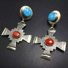 JACK TOM (NAVAJO) TUFA CAST STERLING SILVER WATERWEB TURQUOISE and CORAL EARRINGS DESCRIPTION:  These gorgeous earrings will be a cherished addition to your collection of quality Native American jewelry. MEASUREMENTS: 2 1/2" x 1 1/2" WEIGHT:  20.9 grams unsigned, by Jack Tom (Dine') STERLING:  yes, stamped STERLING Tufa Casting, Silver Cross Earrings, Jewelry Measurements, Turquoise And Coral, Coral Earrings, Cross Earrings, Sterling Silver Cross, American Jewelry, Silver Cross