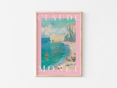 a pink poster hanging on the wall next to a white wall with an ocean scene