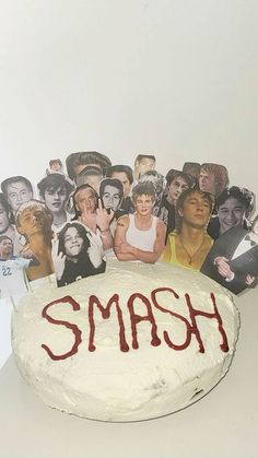 a cake with the word smash on it surrounded by pictures of women and men's faces