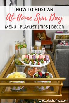 a table filled with food and drinks on top of a wooden table next to a couch