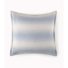 a blue and white striped pillow on a white background