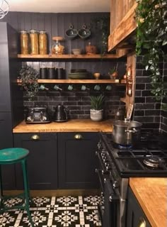 a kitchen with black and white tile flooring and wooden shelves filled with potted plants