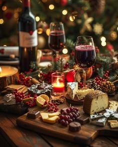 wine, cheese and crackers on a wooden table with christmas lights in the background