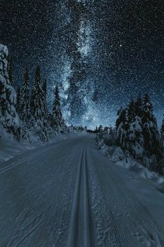 the night sky is filled with stars and snow as it shines brightly in the distance