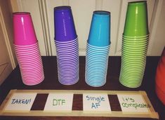 a pile of colorful cups sitting next to each other